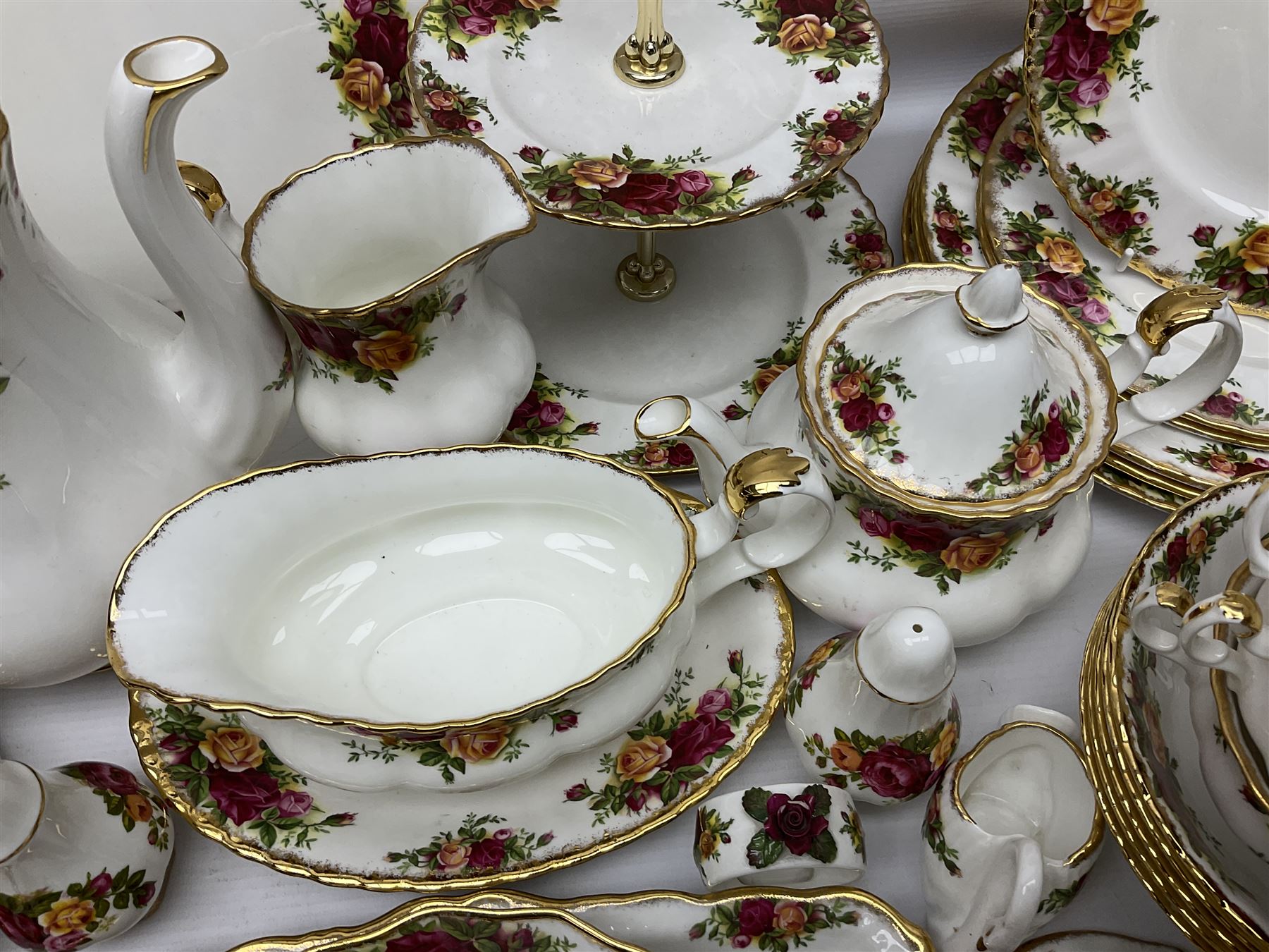 Royal Albert Old Country Roses pattern coffee service for six, comprising coffee pot, milk jug, cups and saucers, cake plate, together with miniature teapot, six teacups and saucers, six dinner plates, six side plates etc 