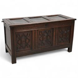 18th century carved oak blanket chest, panelled hinged lid over panelled front, carved wit...