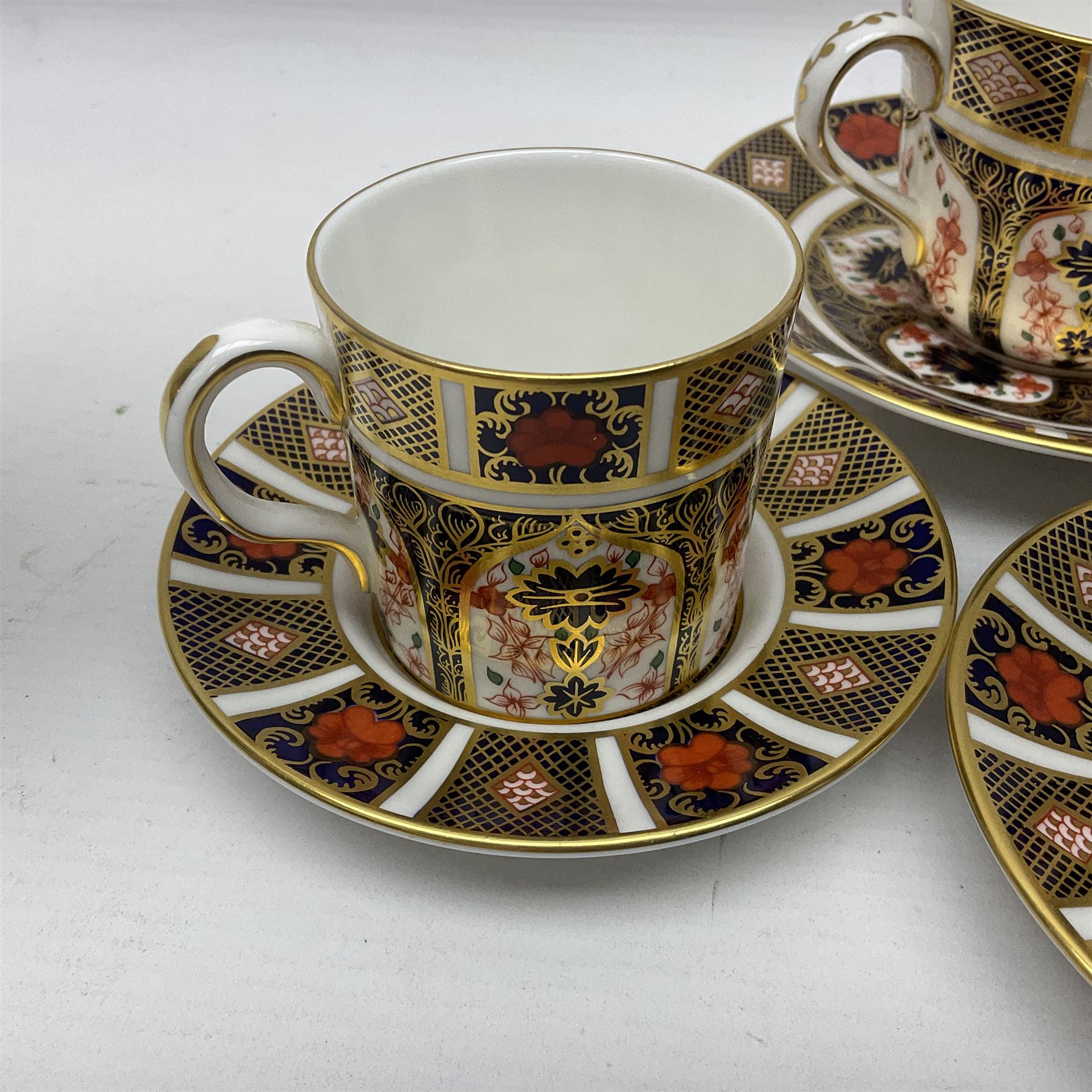 Royal Crown Derby 1128 Imari pattern two coffee cans and saucers, two teacups and saucers, all with printed mark beneath 