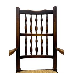 Matched set of twelve 19th century elm Lancashire spindleback dining chairs, shaped cresting rail over spindle back, rush seat, on turned supports united by turned stretchers, ring and globular turned front stretcher 