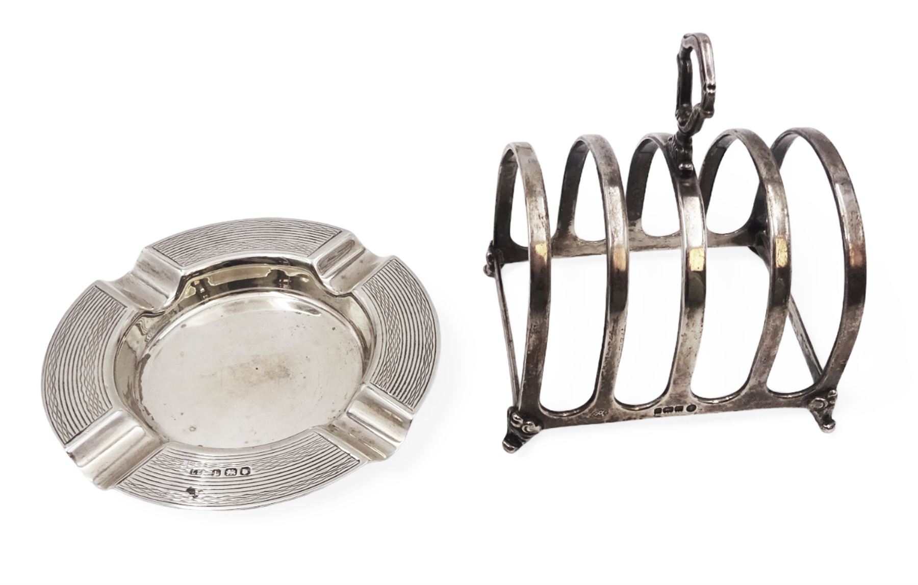 1930s silver five bar toast rack, with loop handle, hallmarked Adie Brothers Ltd, Birmingham 1934, together with a 1940s silver ashtray with engine turned decoration, hallmarked, toast rack H9cm