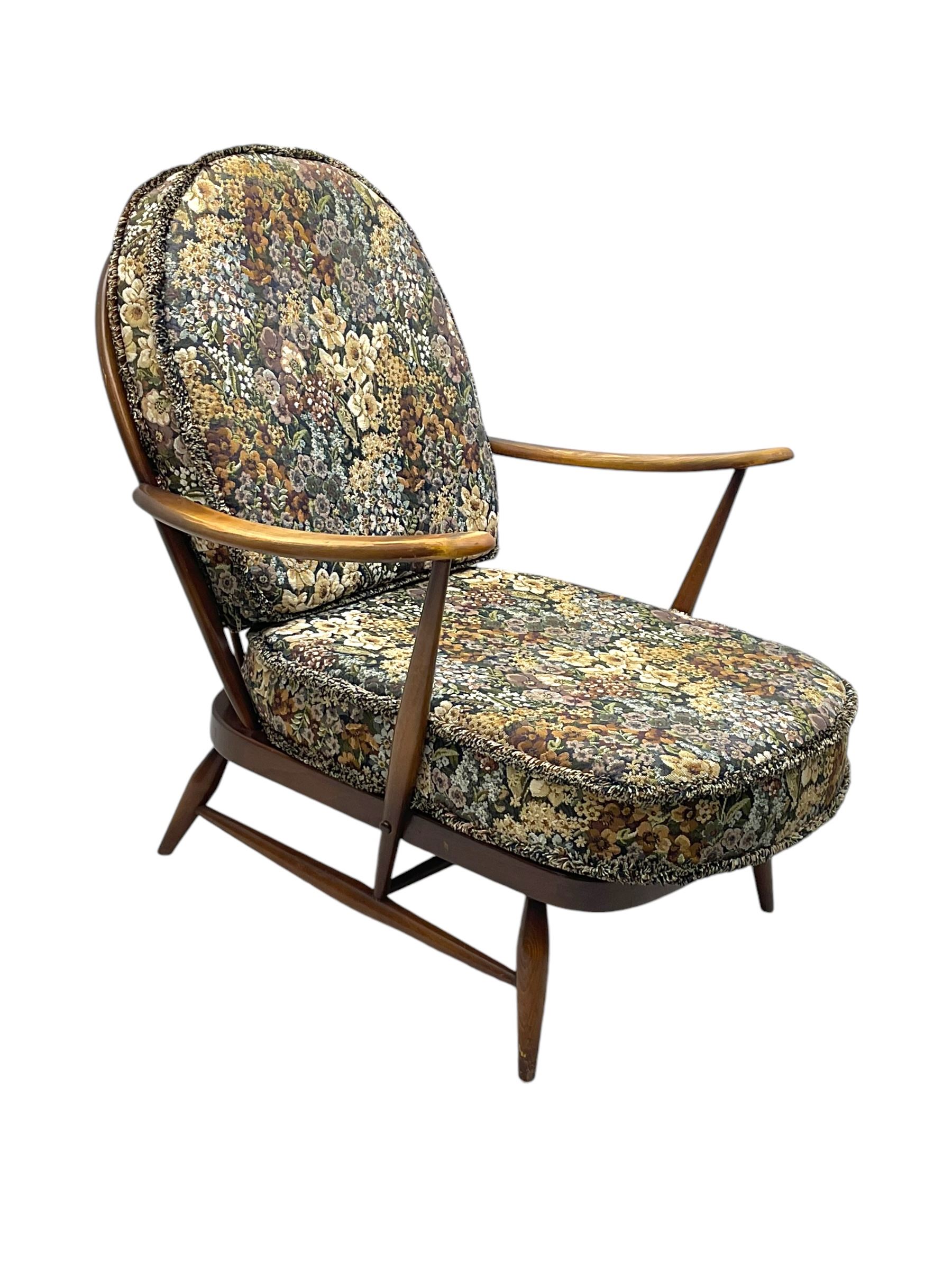 Lucian Ercolani for Ercol - mid-20th century beech and elm 'Windsor 203' two-seat sofa, wingback design upholstered in floral pattern over sprung seat and backrest, open curved arms, on splayed supports with stretchers (W133cm, D87cm, H90cm); matching easy chair (W70cm, D97cm, H82cm)