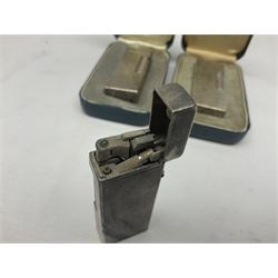 Three Dunhill silver plated lift-arm lighters, of rectangular form with engine turned decoration, marked Dunhill, two with original cases 