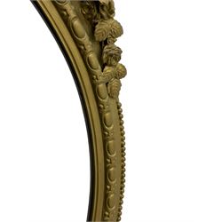 19th century giltwood and gesso girandole wall mirror, the raised pediment decorated with ribbon tie over curled acanthus leaves and flowerhead festoons, oval egg and dart moulded frame with outer bead, three projecting candle sconces in the form of scrolled acanthus leaves, lower shell motif with extending leaf decoration 