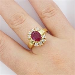 14ct gold oval cut ruby and round brilliant cut diamond cluster ring, stamped, ruby approx 2.00 carat, total diamond weight approx 0.40 carat