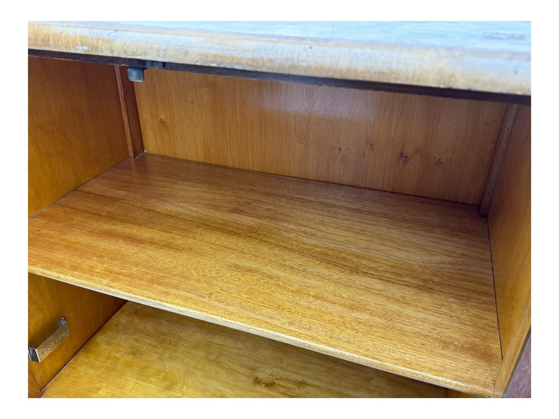 Early 20th century burr walnut cabinet, rectangular top with raised back, over double-door cupboard enclosing camphor interior with single shelf, lower section fitted with two drawers