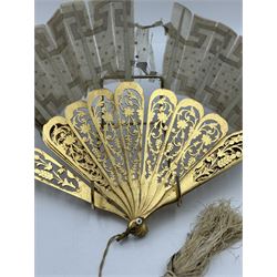 19th century carved gilt wood fan by Eugene Rimmel, the guards and sticks with pierced floral decoration, the chiffon leaf worked with sequins, with silk beaded tassel, stamped E.Rimmel 36 Strand London, with a purple silk lined box 