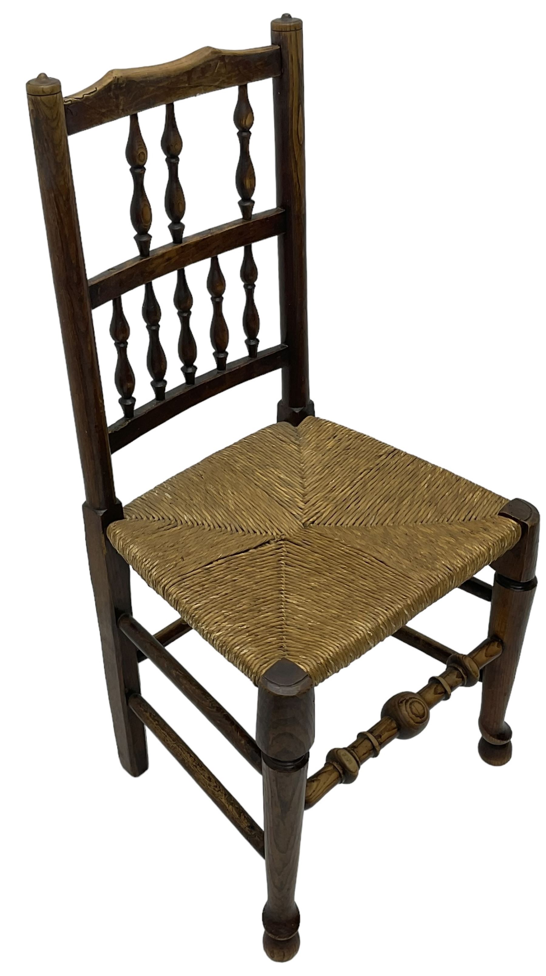 Collection of chairs - five 19th century elm spindle back chairs with rush seats; two chapel chairs (7)