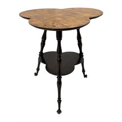 Late 19th to early 20th century stained beech 'Gypsy' table, trefoil or clover shaped top on turned supports united by undertier, on cast metal and glass ball feet 