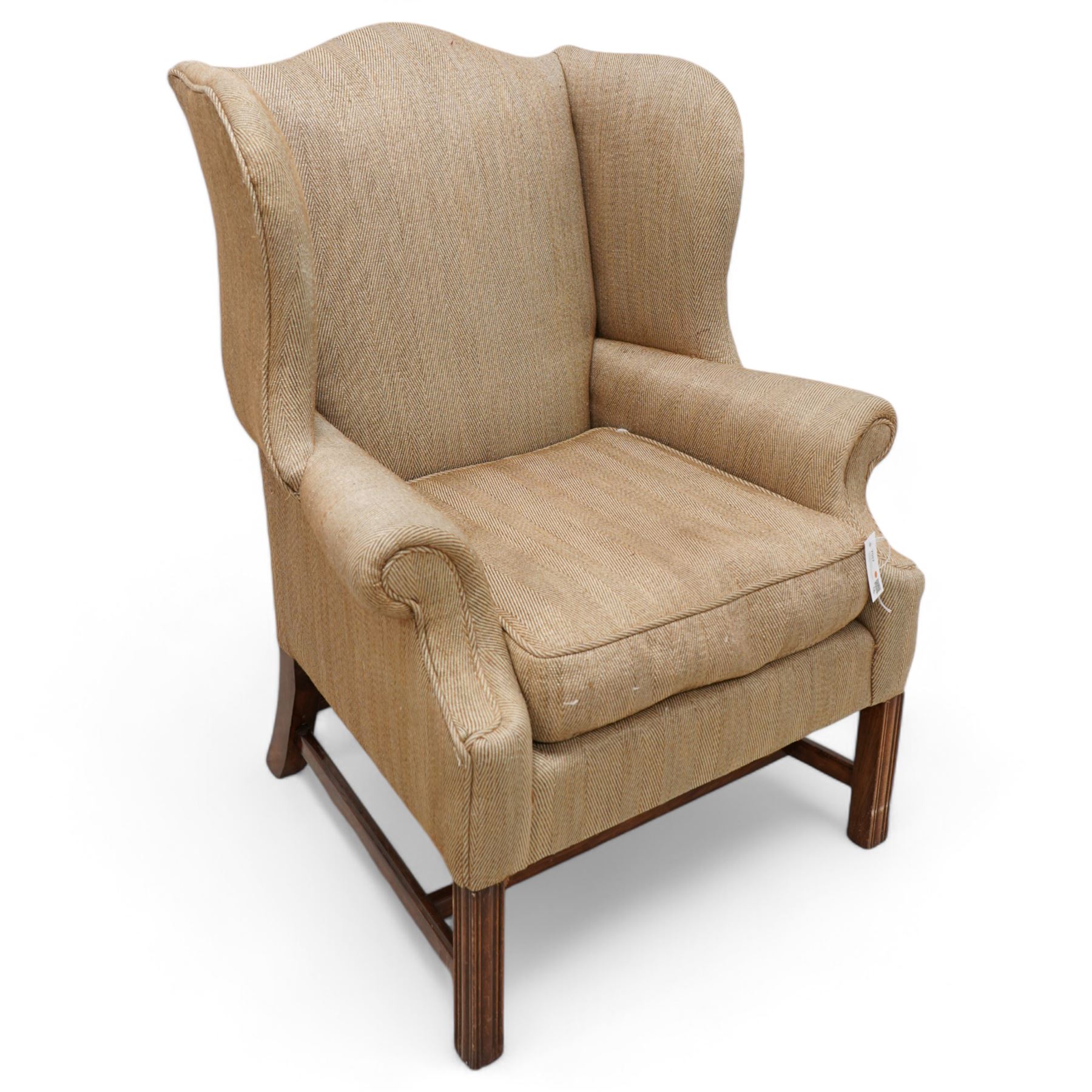 Georgian design wingback armchair, upholstered in brown herringbone fabric, on square moulded supports united by plain H-stretchers