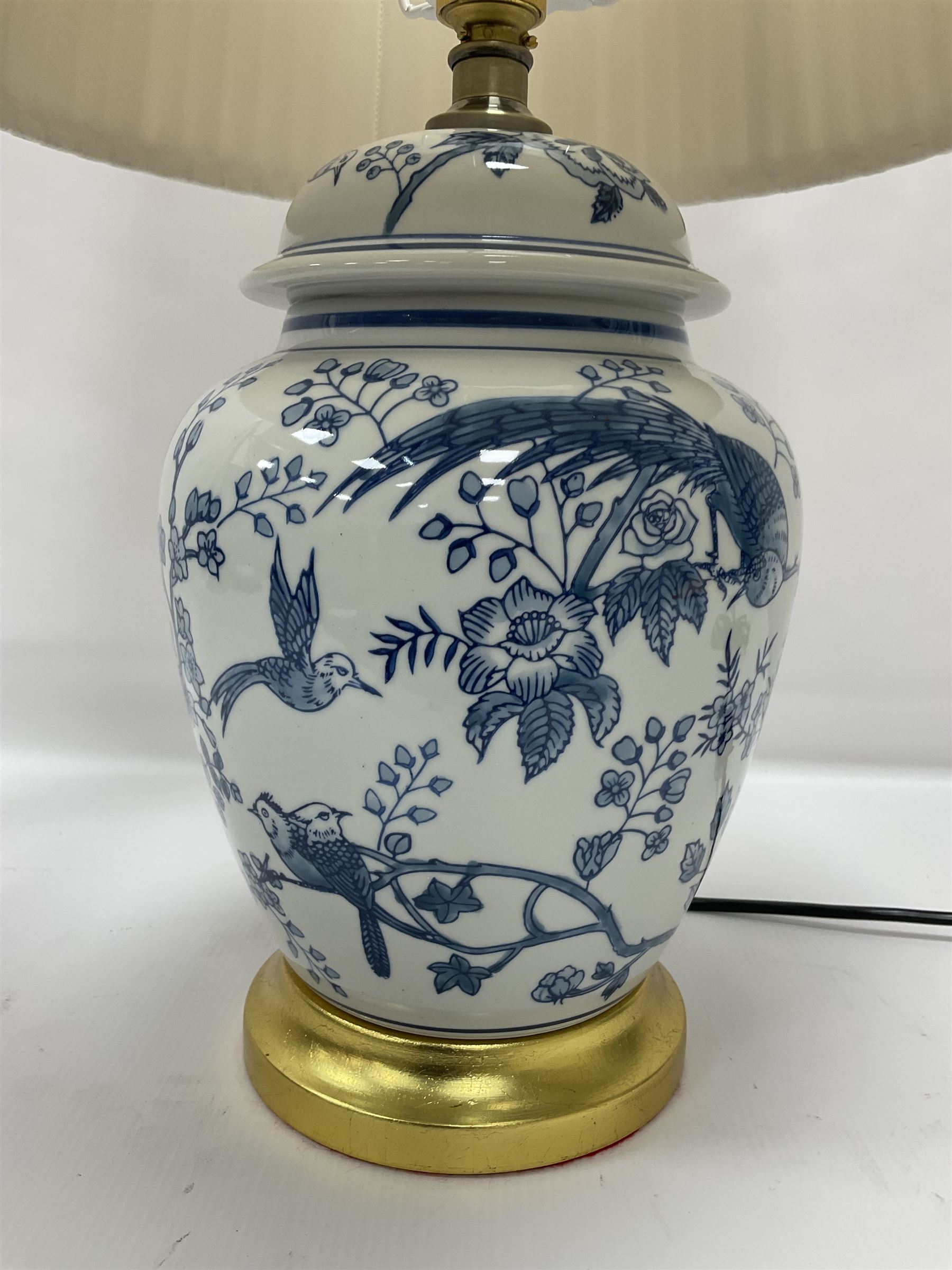 Table lamp of baluster form, decorated with exotic birds up fruiting trees, on gilt chrome pedestal, including shade H554cm