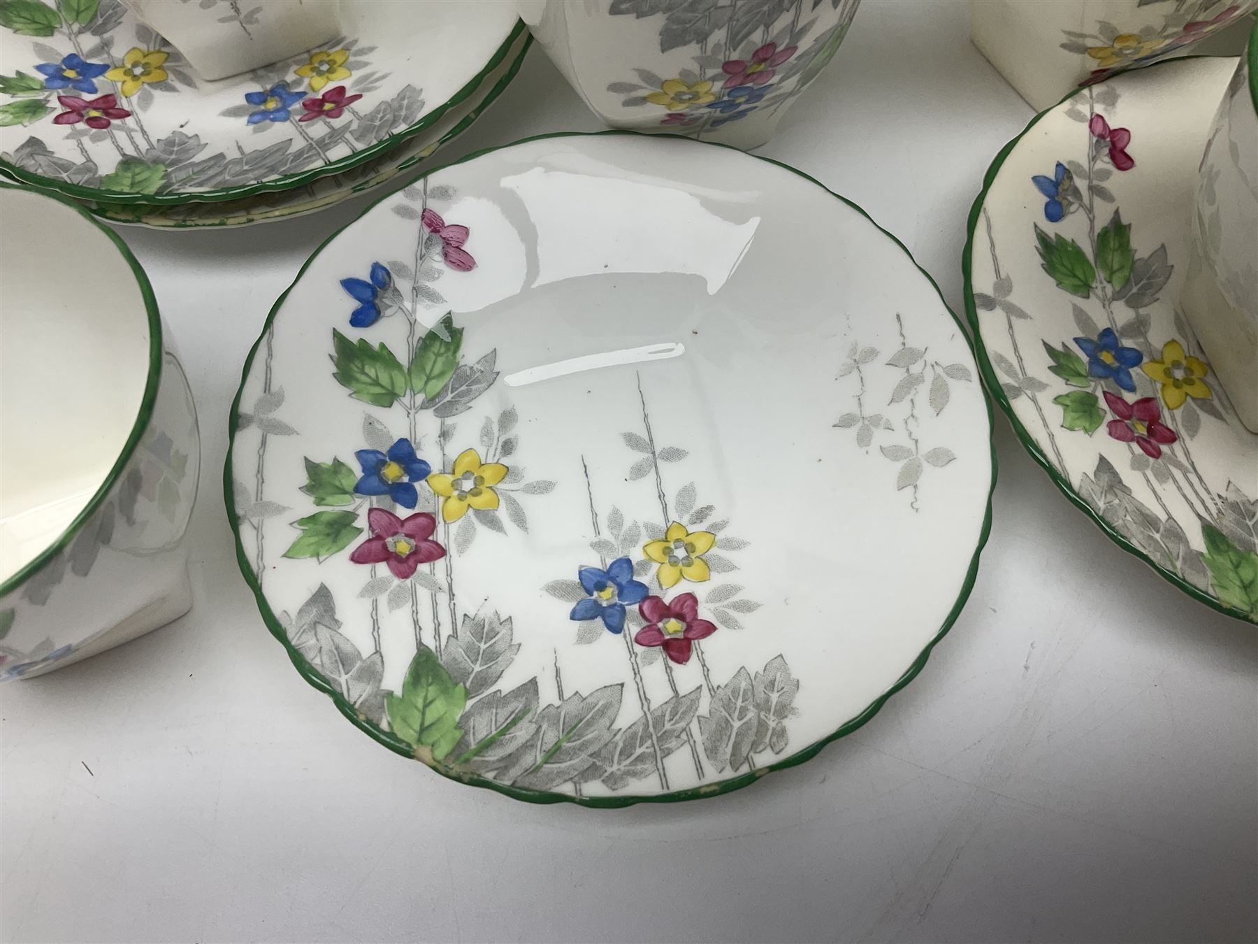 Art Deco Delphine China coffee service for six, comprising coffee pot, open sucrier, milk jug, cups and saucer, with floral decoration