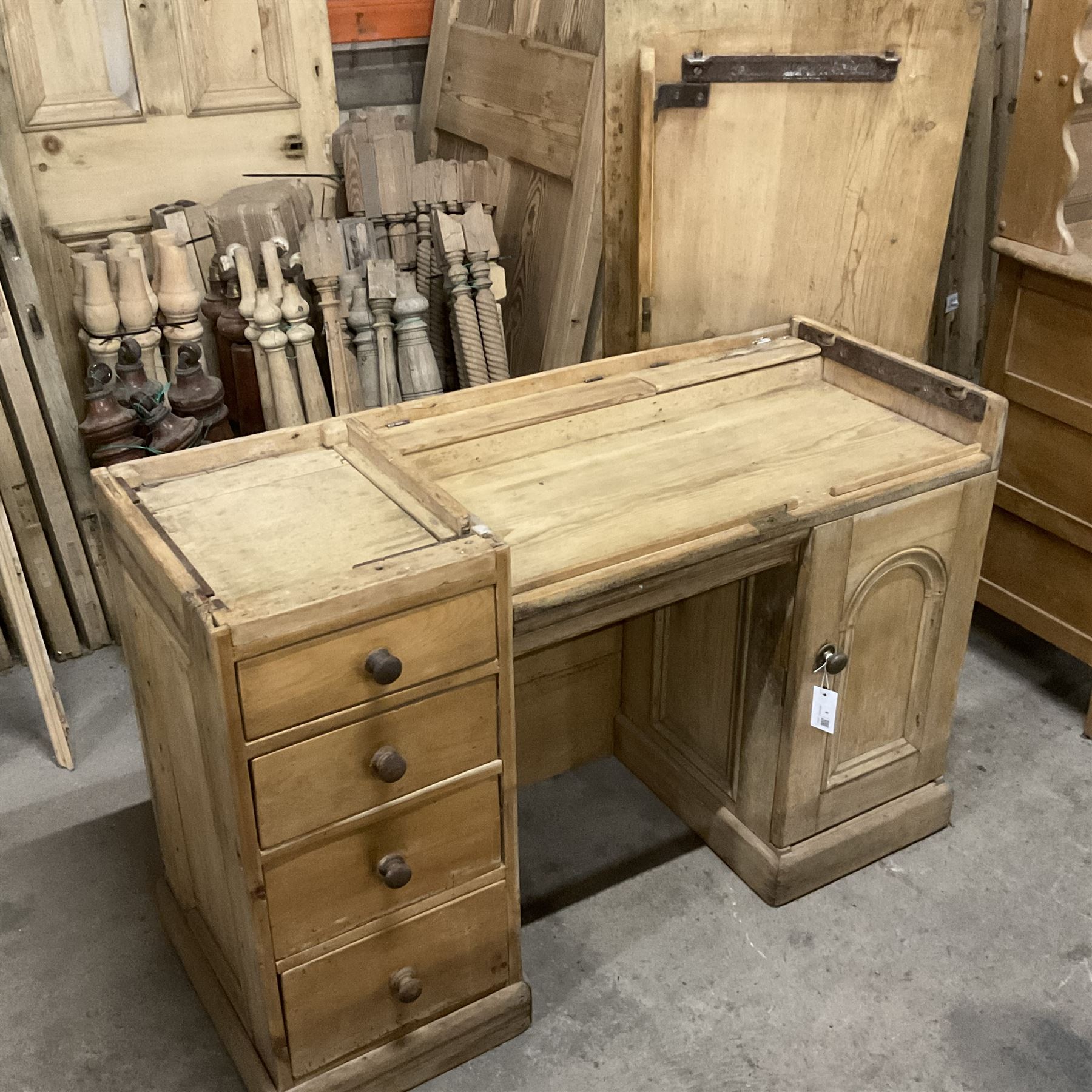 Victorian pine twin pedestal desk, rectangular to over four drawers, central shallow drawer and panelled cupboard, the removable top reveals hidden storage compartments, on skirted base - THIS LOT IS TO BE COLLECTED BY APPOINTMENT FROM THE OLD BUFFER DEPOT, MELBOURNE PLACE, SOWERBY, THIRSK, YO7 1QY