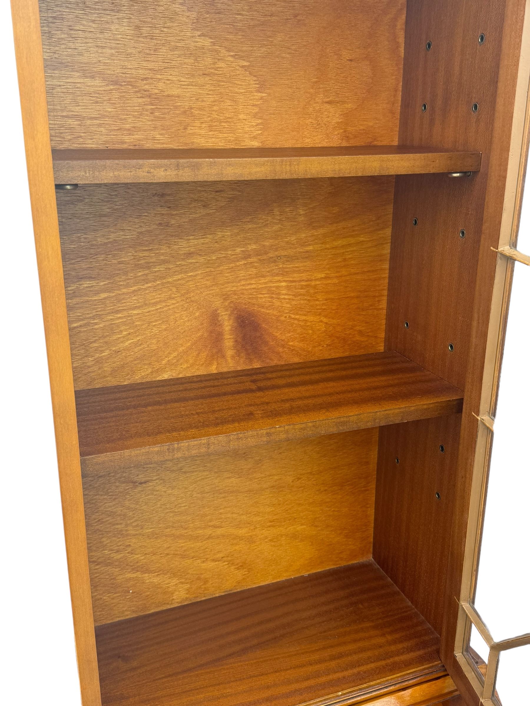 Mid-to-late 20th century yew wood bureau bookcase, raised bookcase enclosed by glazed door, the fall front revealing fitted interior, four graduating cock-beaded drawers below, on bracket feet