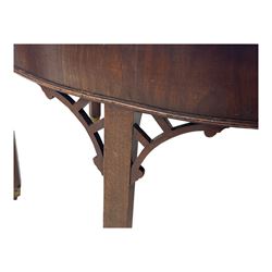 Early 19th century mahogany demi-lune extending dining table, two D-ends with central leaf insert, raised on eight square supports with arched spandrels terminating in brass castors