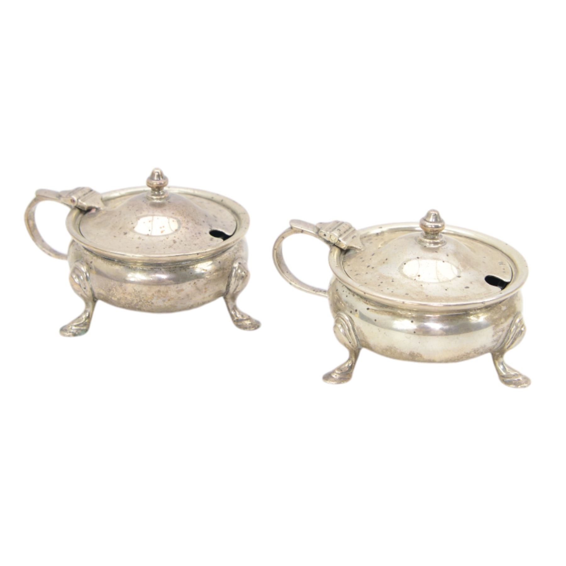 Silver double condiment set comprising pair of salts, pair of pepperettes and pair of mustards with hinged lids all on shaped supports London 1937-40 marked for W Greenwood & Sons