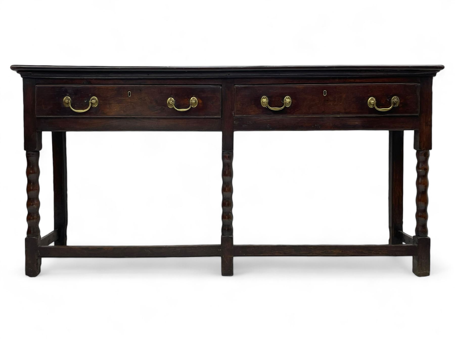 18th century oak dresser base, rectangular top, fitted with two drawers with moulded facia edges and brass swan neck handles, raised on turned front supports united by stretchers