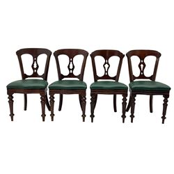 Matched set of twelve Victorian mahogany dining or boardroom chairs, the shaped cresting rail decorated with scrolled decoration, upholstered drop-on seats upholstered in green fabric, on turned supports  