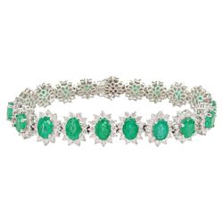 18ct white gold oval emerald and round brilliant cut diamond cluster bracelet, stamped 750, total emerald weight 14.70 carat, total diamond weight 7.24 carat