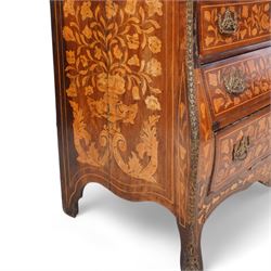 18th century Dutch marquetry walnut and gilt metal mounted vitrine cabinet on chest, shaped pediment carved with scrolling foliage cartouche, inlaid with trailing leafy branches and flower heads, two internal shelves enclosed by two glazed doors, the lower section with bombe outline fitted with three drawers, with ornate cast gilt metal edging and terminal caps