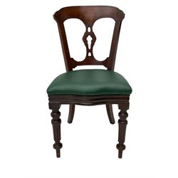 Matched set of twelve Victorian mahogany dining or boardroom chairs, the shaped cresting rail decorated with scrolled decoration, upholstered drop-on seats upholstered in green fabric, on turned supports  