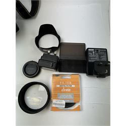 Nikon D5100 SLR camera body serial no. 6353702, together with three lenses, to include Tamron 18-270mm 1:3.5-6.3 serial no. 062941,  serial no. 50524365, Nikon AF-S DX Nikkor 18-55mm 1:3.5-5.6GII serial no. 2396396 and a collection of associated accessories, including battery grip, three large tripods, flashes, filters, Caden carry case, etc 