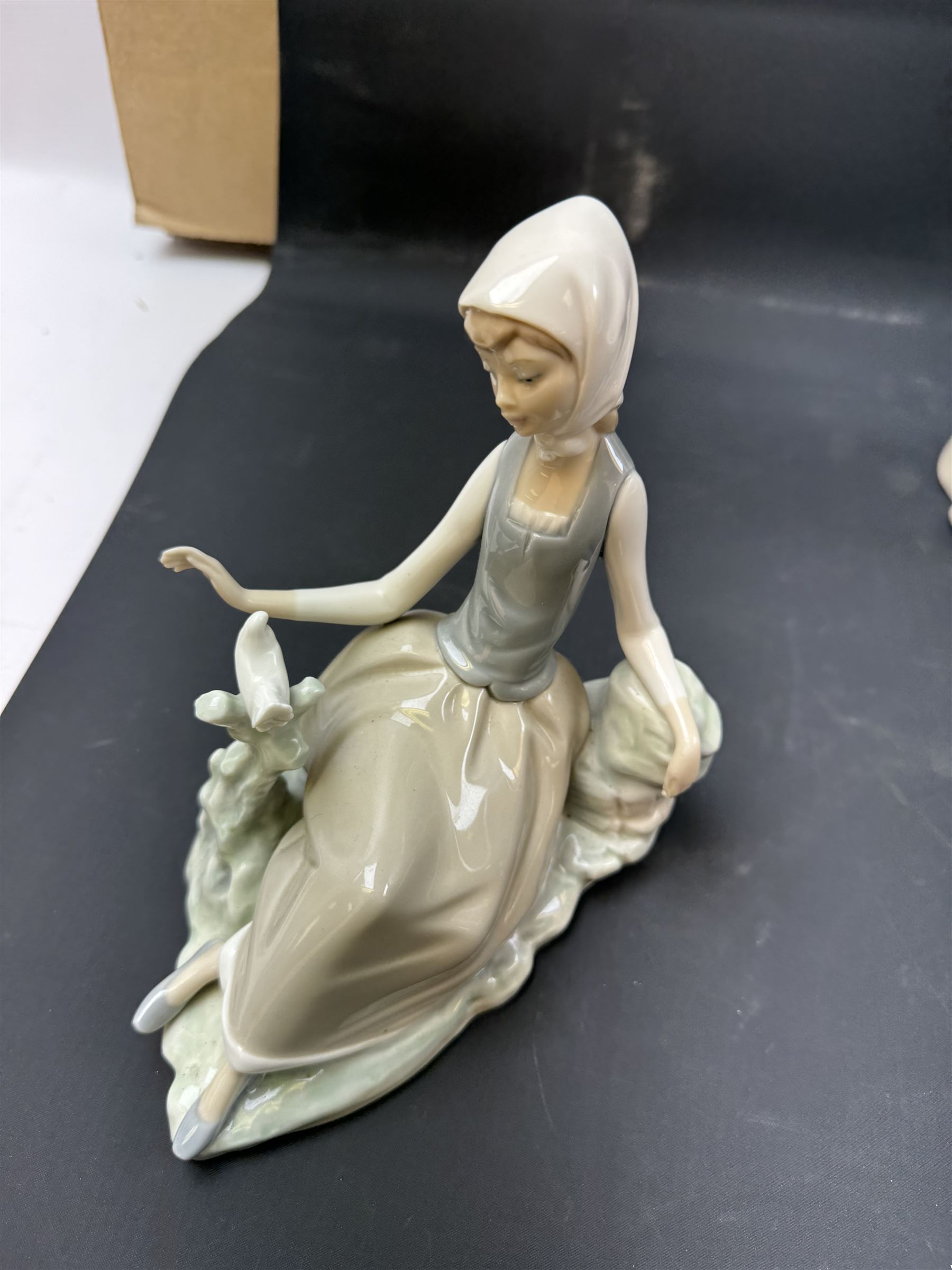 Four Lladro figures, including Girl with Lamb, Girl with Dove etc