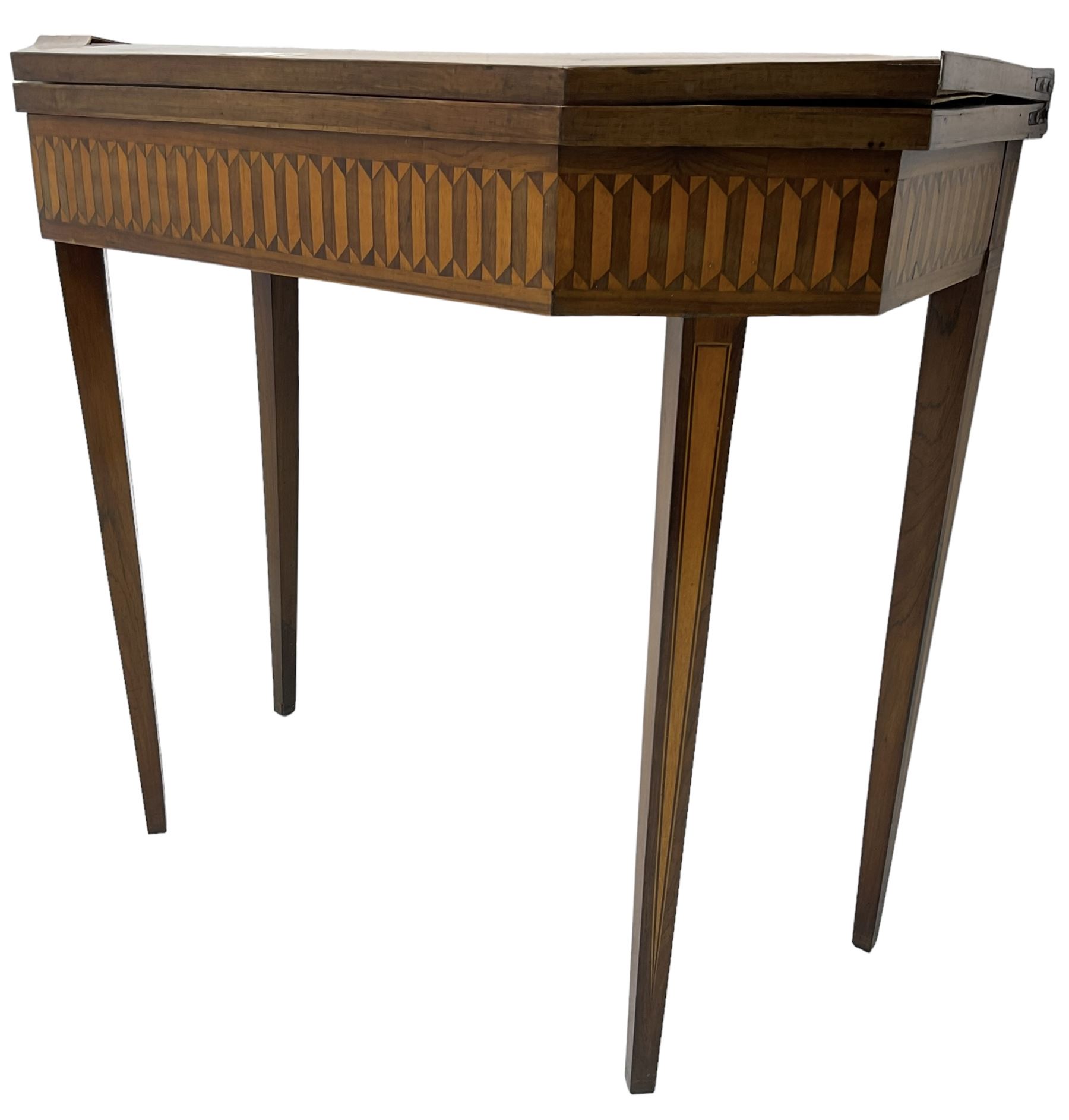 19th century inlaid mahogany card table, rectangular fold-over top with canted front corners, decorated with banded and strung edge with central inlaid fan motif, frieze decorated with geometric inlay, over a single action gate-leg base with square tapering supports