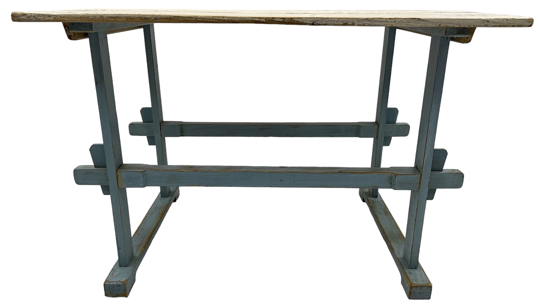 Early 20th century pine rustic dining table, rectangular plank top with weathered patina, over trestle-style supports in distressed blue paint with central stretcher