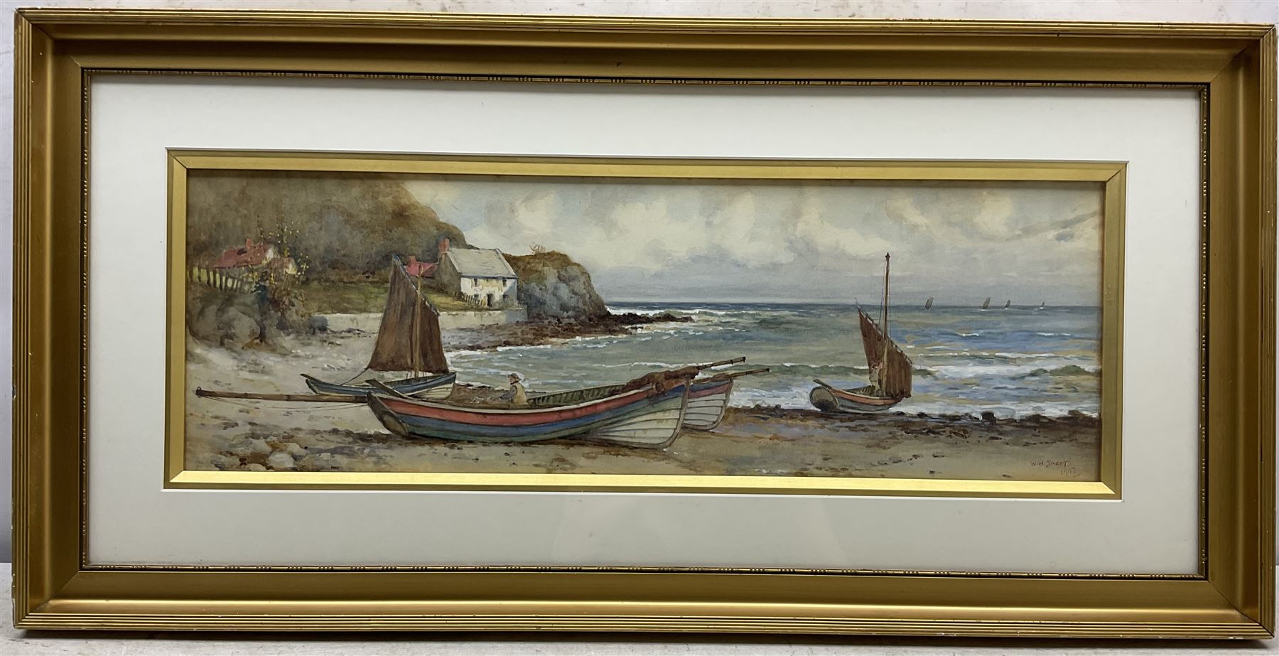 Walter Henry Sweet (British 1889-1943): Cobles at Runswick Bay, watercolour signed and dated 1907, 20cm x 61cm