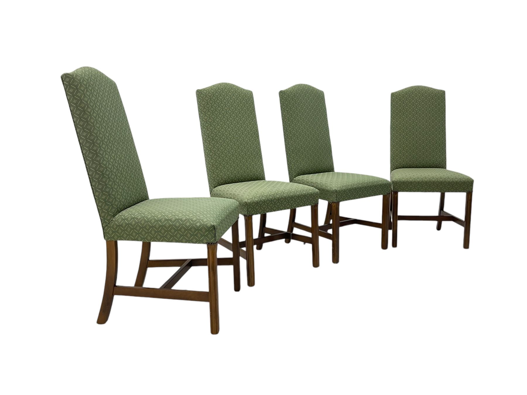 Early 20th century oak extending dining table, rectangular top with rounded corners, on turned baluster supports united by X-stretchers, fitted with a pull-out extending mechanism (106 x 142 - 228cm, H76cm); set of eight high-back dining chairs upholstered in green fabric with geometric diamond pattern