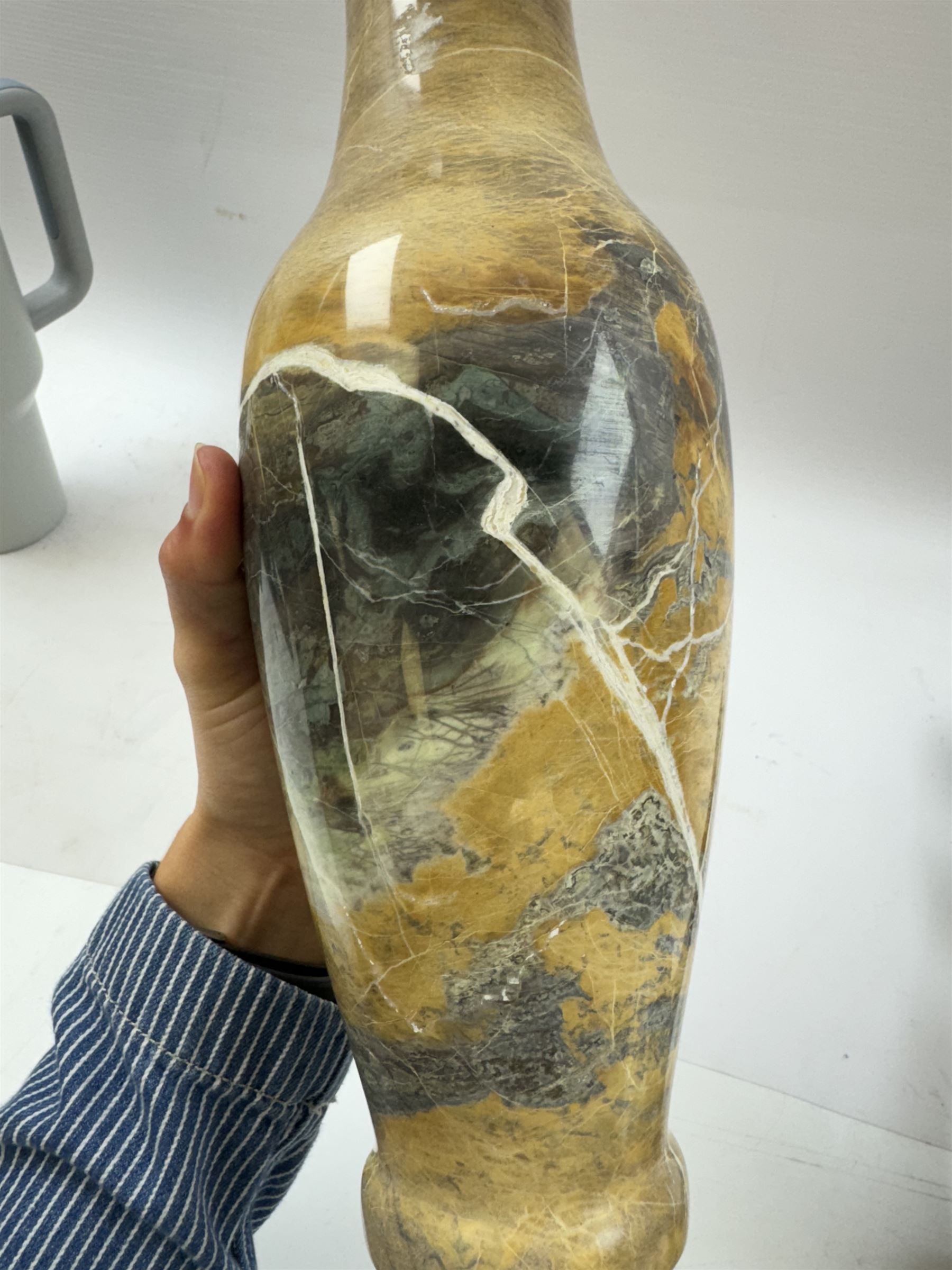 Marble vase, of baluster form, in cream and green hues with white veins, H35cm