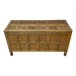 Sid Pollard (ex. Mouseman) - Yorkshire oak blanket chest, all over panelling, enclosed by hinged lid, on octagonal feet, interior plaque inscribed 'S. Pollard, Bagby, Thirsk, Yorks' 