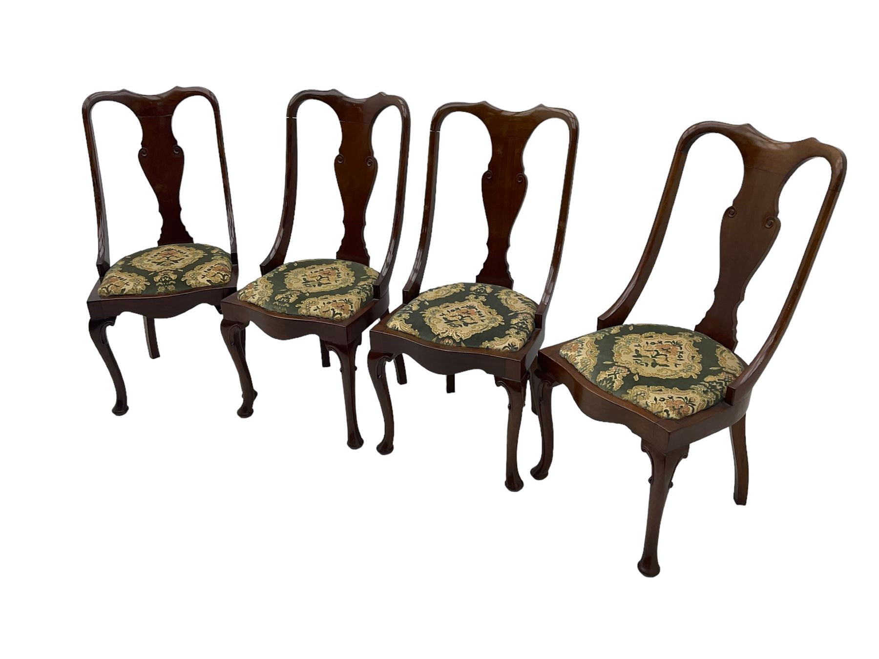 Set of eight late 19th century mahogany spoon back dining chairs, each with shaped top rail over Queen Anne design vase-shaped splat, upholstered seats in floral patterned fabric, raised on cabriole supports with scroll carved knees