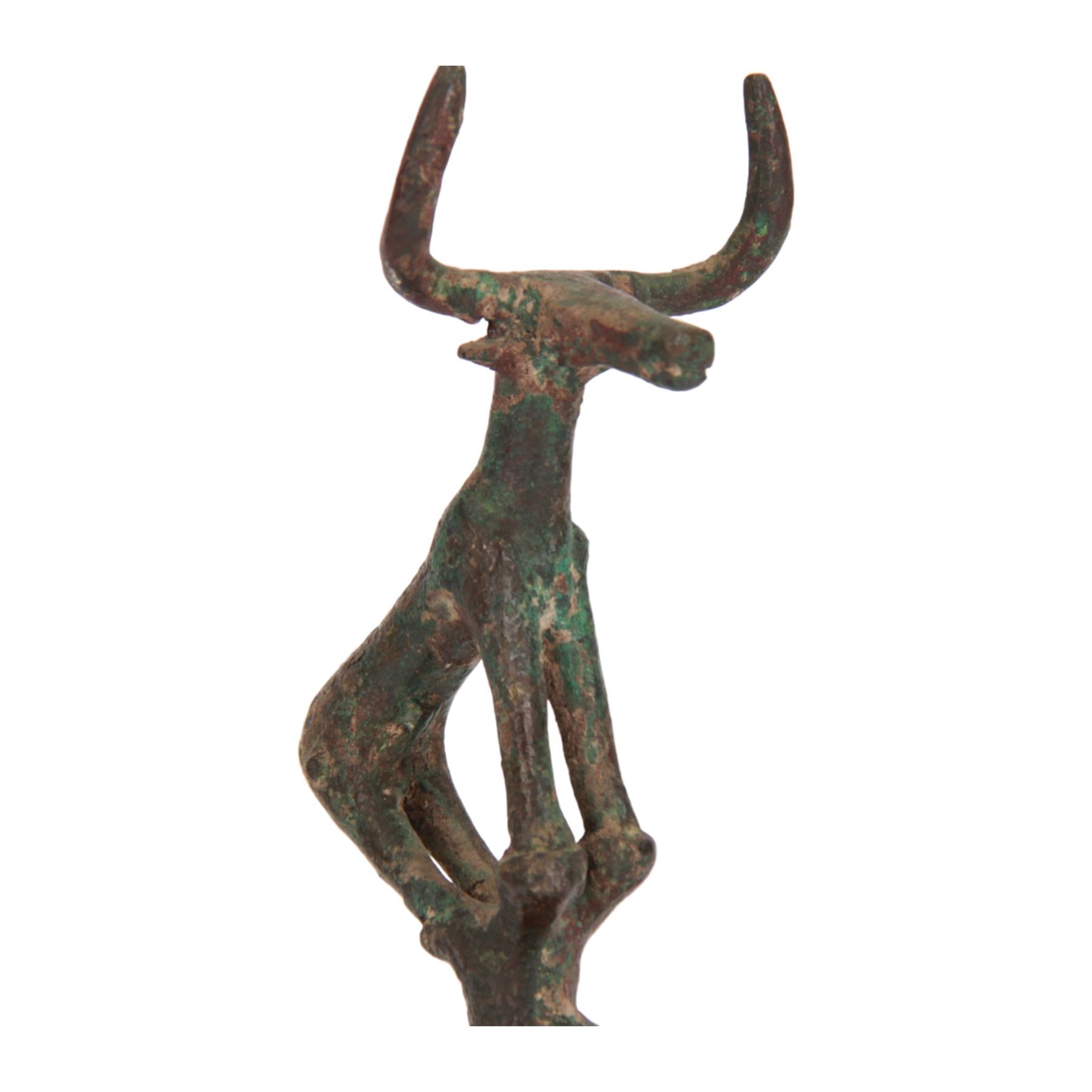 Hattian bronze bull standard, modelled stood upon stand, with long muzzle, raised pellet eyes, and large upraised horns, upon a later octagonal black plinth, bronze H18cm, overall H22cm