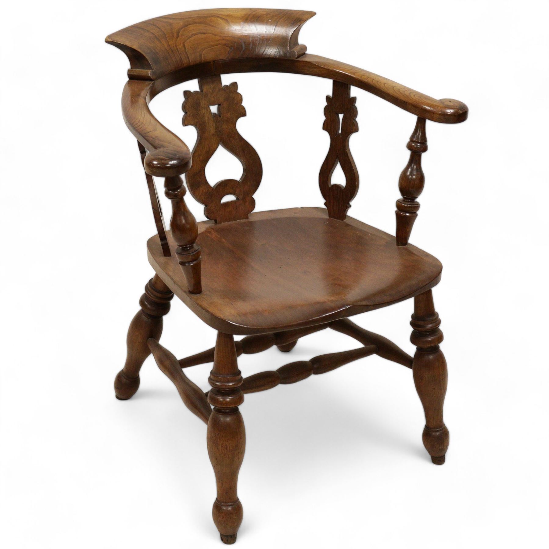 19th century elm and beech smokers bow Captains armchair, shaped and pierced splat, saddle seat, double H stretcher