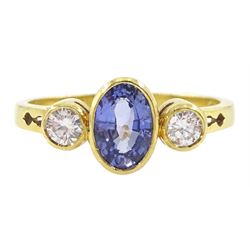 18ct gold three stone oval cut sapphire and round brilliant cut diamond ring, hallmarked, ...