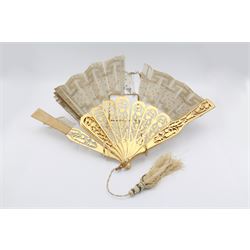 19th century carved gilt wood fan by Eugene Rimmel, the guards and sticks with pierced floral decoration, the chiffon leaf worked with sequins, with silk beaded tassel, stamped E.Rimmel 36 Strand London, with a purple silk lined box 