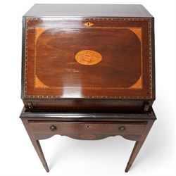 19th century inlaid mahogany bureau on stand, sloped moulded lid inlaid with shell motifs and parquetry bands, the interior fitted with drawers, small cupboard and document divisions, inlaid with soldier holding sword and shield flanked by classical columns, the stand fitted with single drawer over shaped apron inlaid with shell, on square tapering supports  