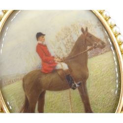 Early 20th century 15ct gold seed pearl locket pendant, with later overpainted print of a huntsman on horseback