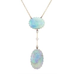 Early 20th century gold opal and diamond pendant necklace, two oval cabochon cut opals spaced by three milgrain set old cut diamonds, total opal weight approx 16.85 carat