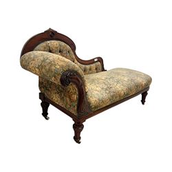 Victorian Aesthetic Movement mahogany framed chaise longue, shaped carved back over acanthus scrolled arm terminal, upholstered in floral patterned tapestry fabric with sprung seat, on turned and fluted supports with castors