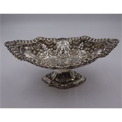 Victorian silver pedestal dish, of navette form, with egg and dart rim, pierced sides and embossed C scroll, foliate and floral decoration, upon a tapering lobed pedestal, embossed with flower heads, hallmarked Elkington & Co Ltd, Birmingham 1899, H6.5cm