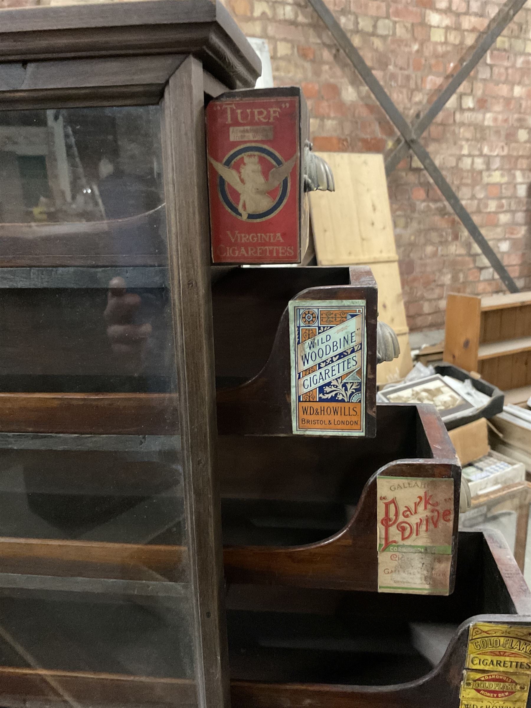 Early 20th stained pine and glazed wall mounting cigarette shop display cabinet, fitted with six sliding drawers with divisions and scalloped handles  - THIS LOT IS TO BE COLLECTED BY APPOINTMENT FROM THE OLD BUFFER DEPOT, MELBOURNE PLACE, SOWERBY, THIRSK, YO7 1QY