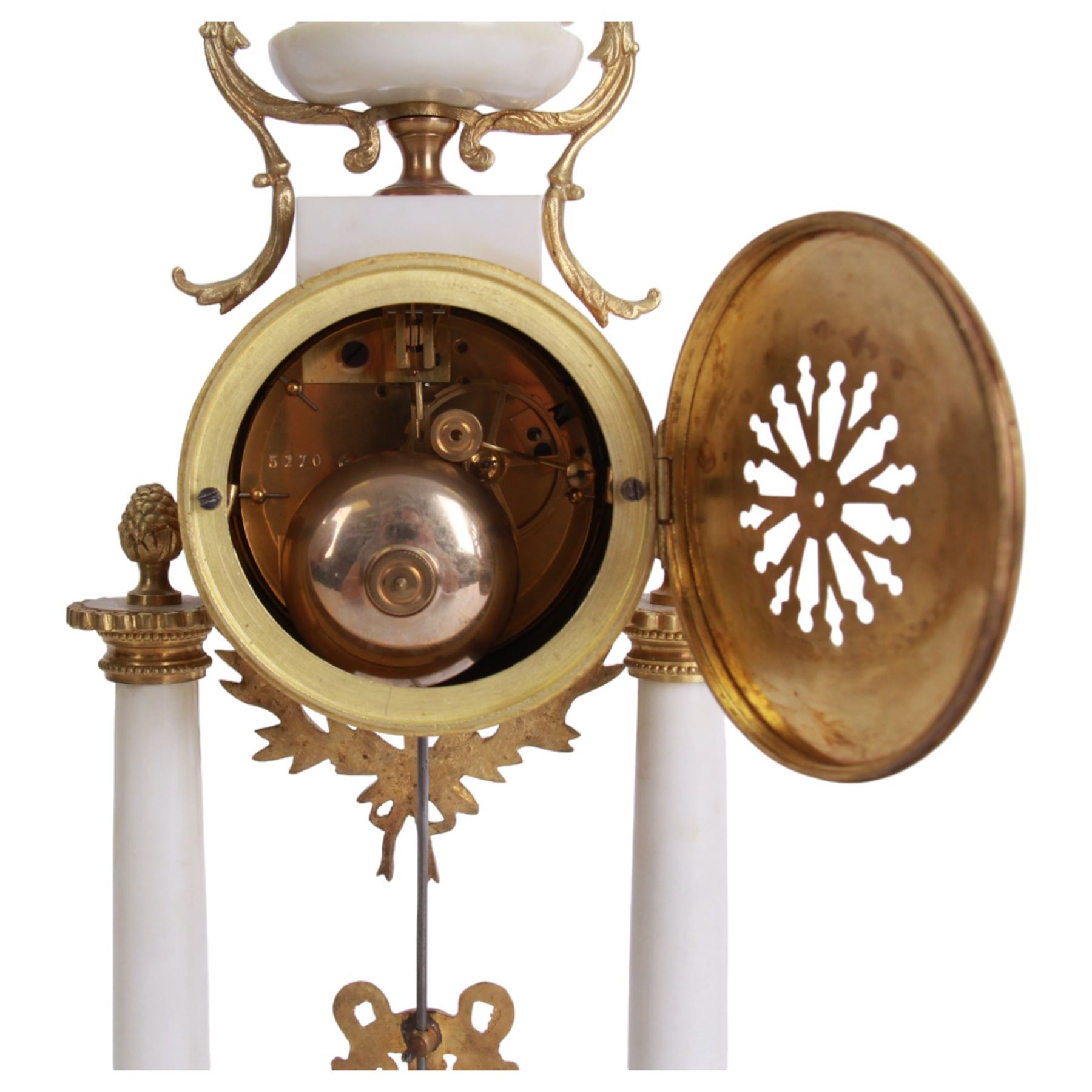 French - Louis XV style white marble and gilt mounted 8-day portico clock garniture c1905, drum movement surmounted by an oval shaped urn, supported on a pair of tapered column supports and raised on a rectangular plinth base, white enamel dial with floral garlands and Arabic numerals, Louis XV style gilt hands within a glazed bezel, twin train countwheel striking movement, striking the hours and half hours on a bell, with a pair of conforming three light candelabra, decorative matching pendulum and key.