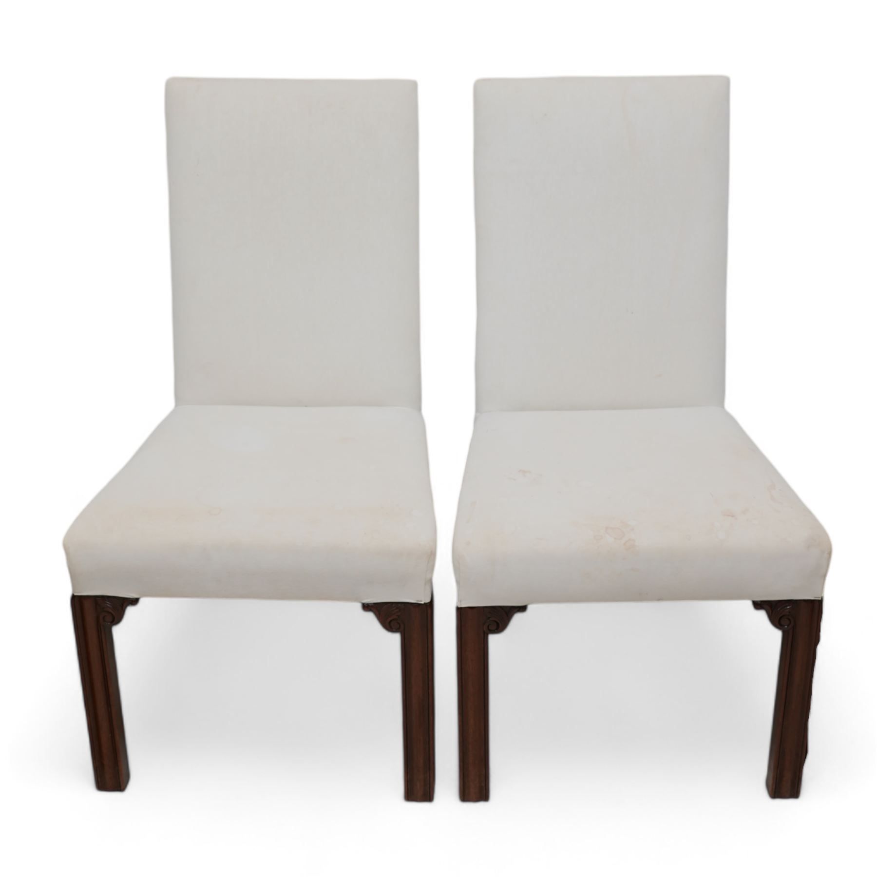 Set of six Georgian design mahogany framed dining chairs, upholstered in calico cover, on moulded square supports with foliate scroll carved brackets 