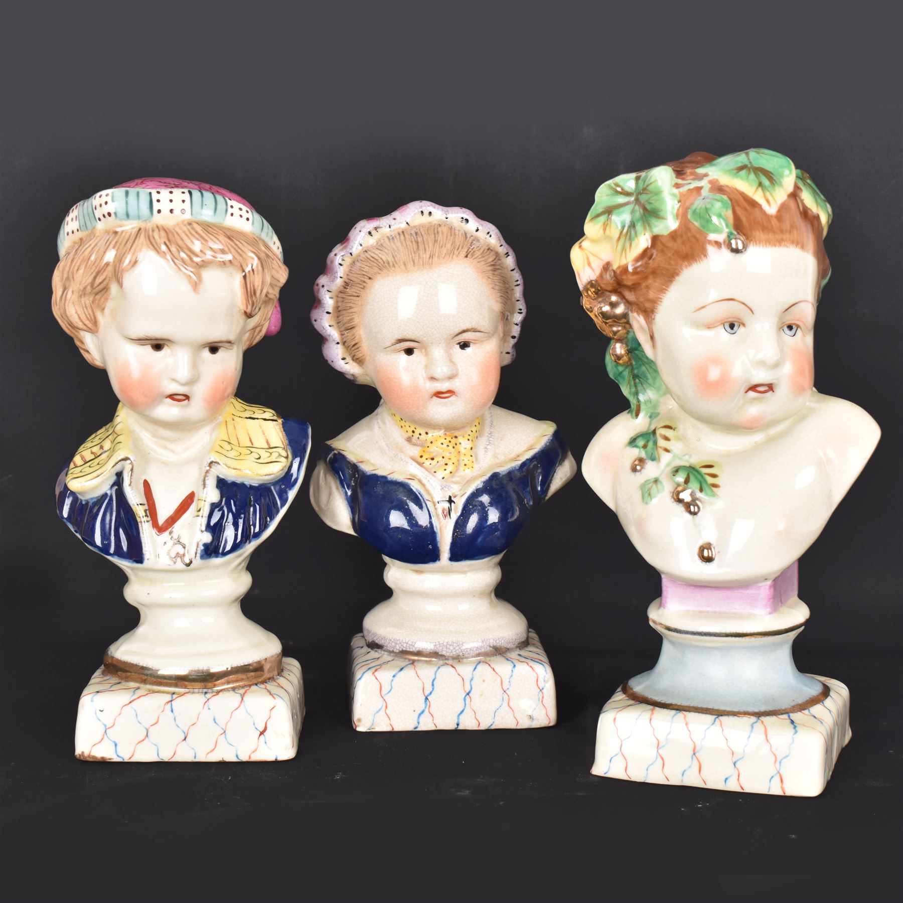 Pair or 20th century continental Bourbon children busts, together with another similar, H23cm