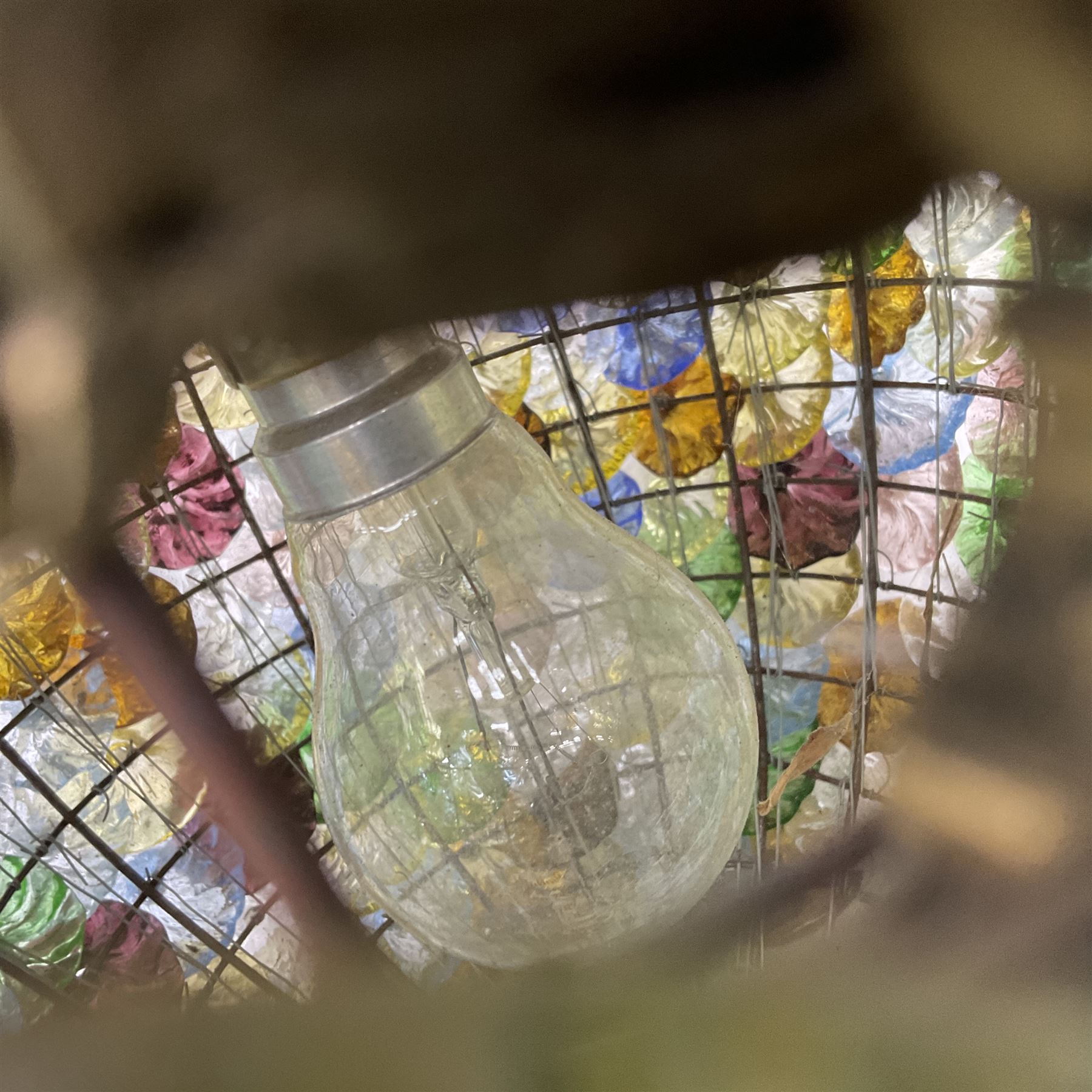 Two 20th century brass and murano glass pendent lanterns, each lantern is decorated with individual multi-coloured glass flowers, suspended from brass cover with floral swags, H40cm