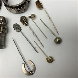 Collection of early 20th century stick pins, including silver, gold, cameo and stone set examples, together with a silver pocket watch holder, embossed with putti decoration, pinchbeck brooch, silver napkin ring, etc