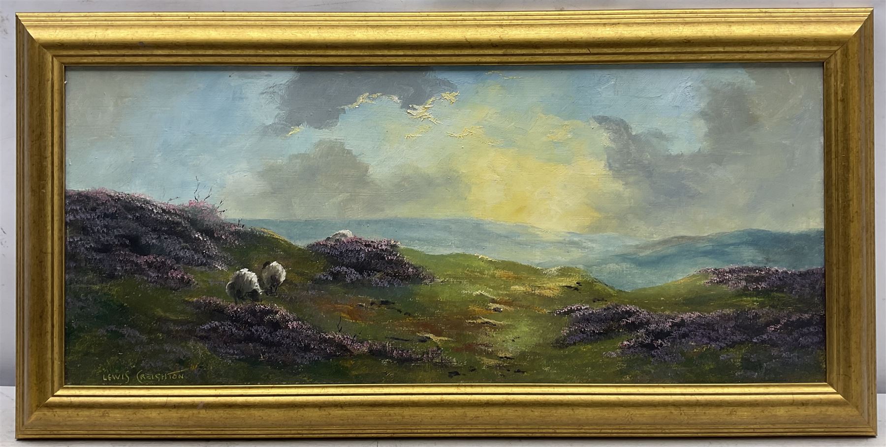 Lewis Creighton (British 1918-1996): Sheep Grazing Amongst Heather Moorland, pair oils on board signed 27cm x 64cm (2)